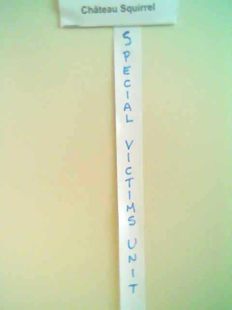 sign on door: Château Squirrel, added ribbon: SPECIAL VICTIMS UNIT